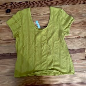 A mustard yellow tight fit shirt